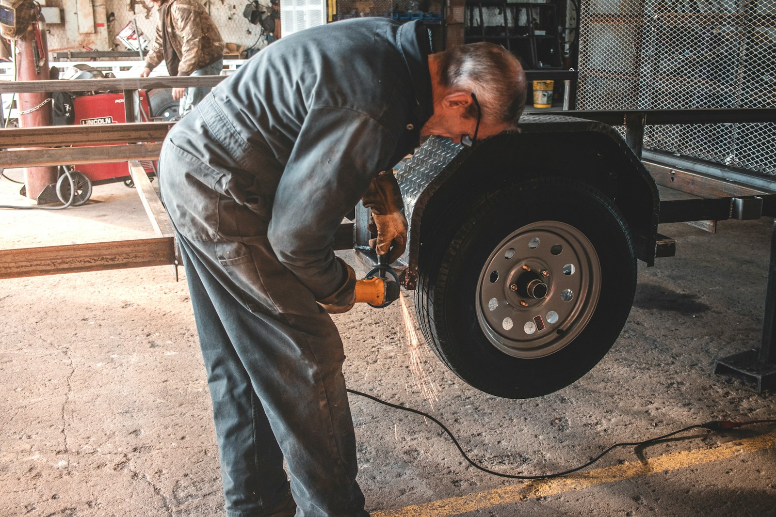 man fixing a vehicle tire