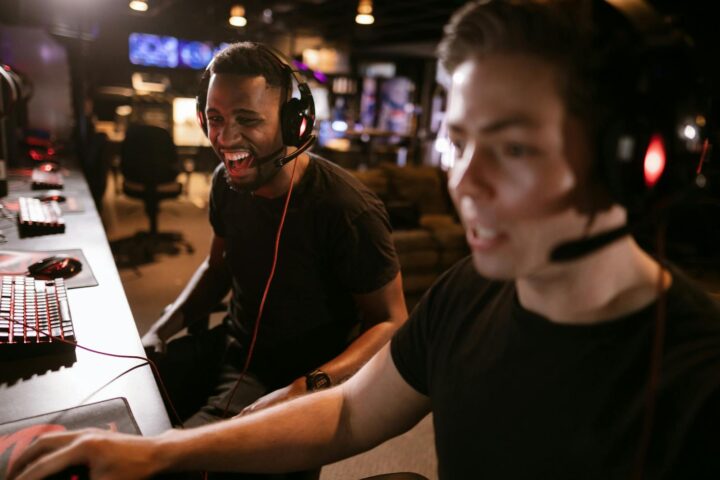 Two friends playing video games together, capturing the excitement and camaraderie of gaming.