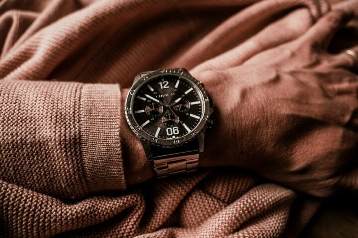 a person wearing a watch on their wrist