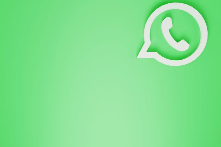 a green wall with a white phone on it