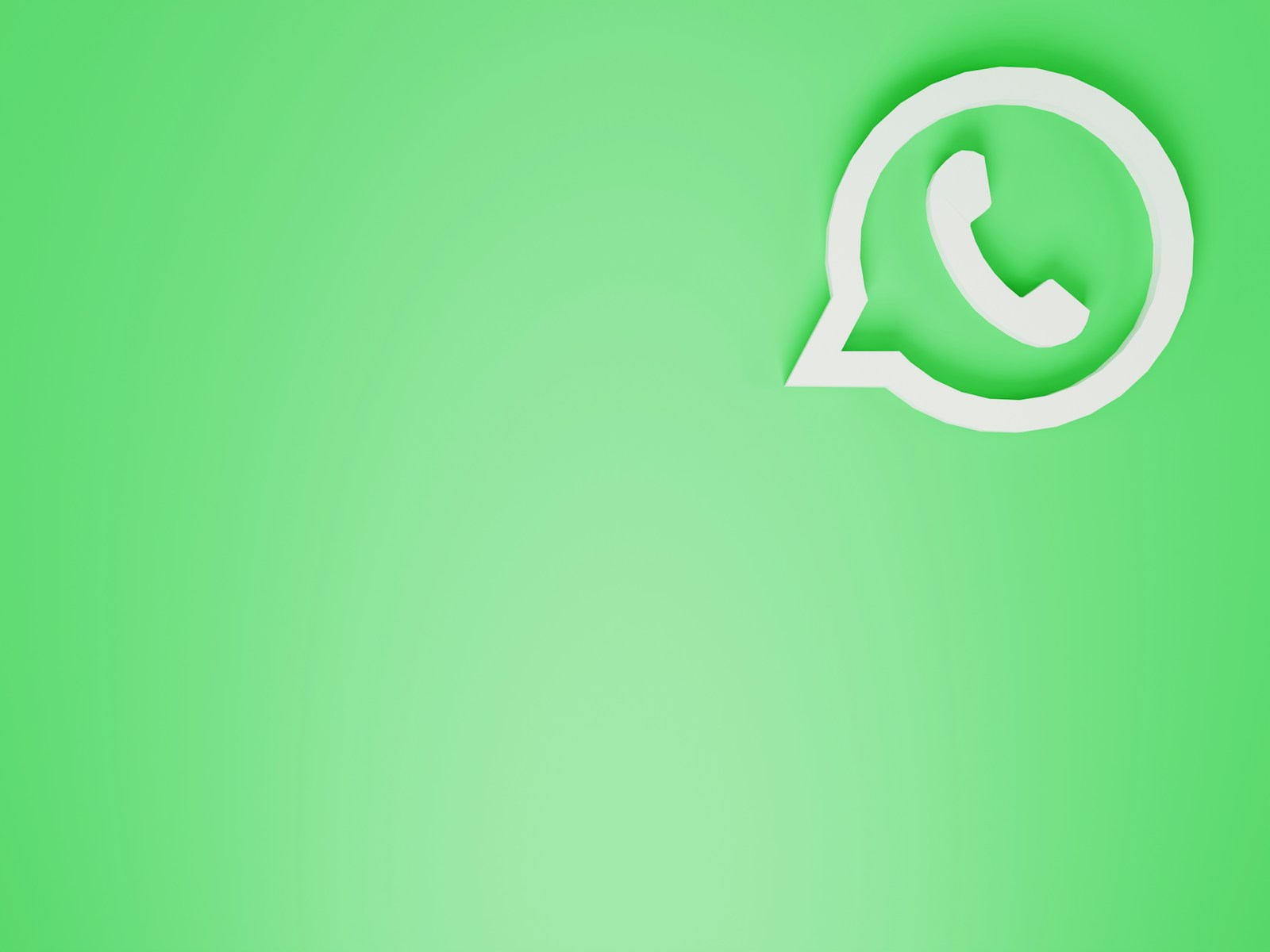 a green wall with a white phone on it