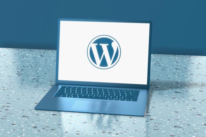a laptop computer sitting on top of a table