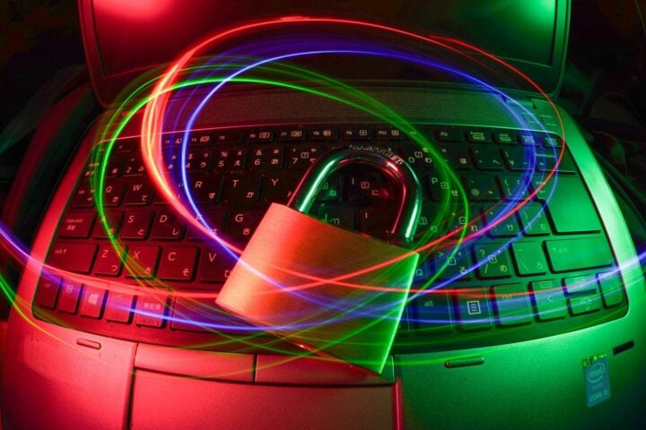 padlock on laptop with light trails