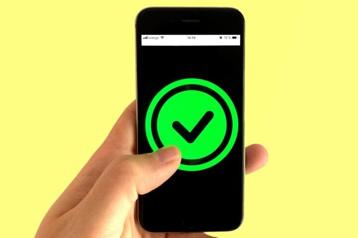 black android smartphone displaying green and black logo