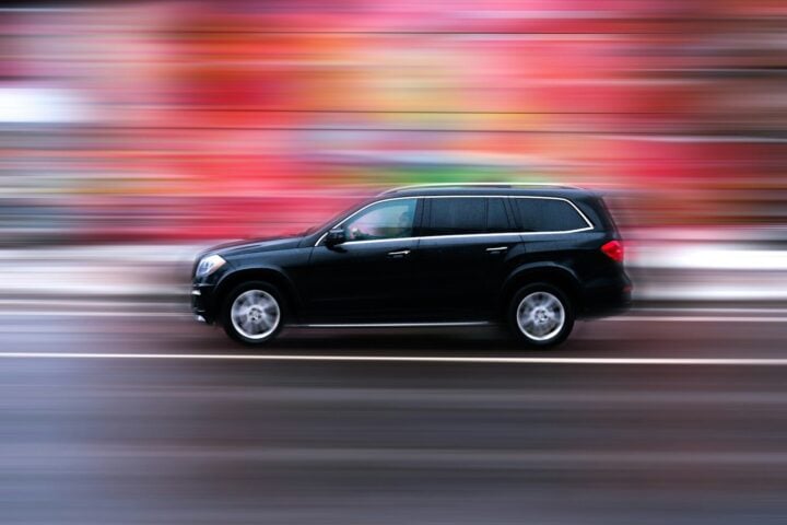 black suv on road during daytime