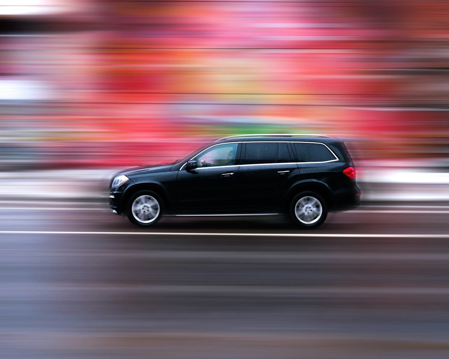 black suv on road during daytime