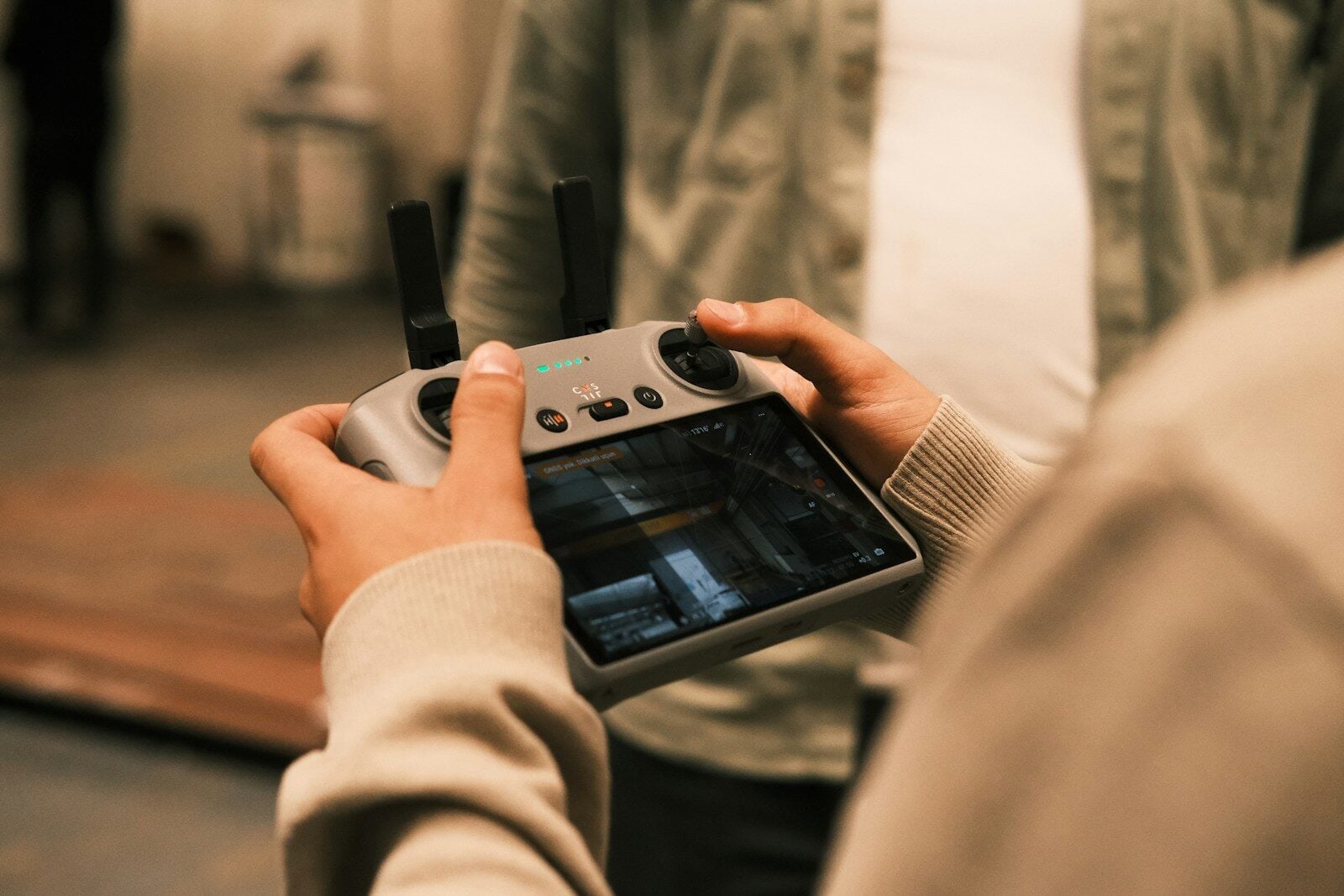 A person holding a device in their hands